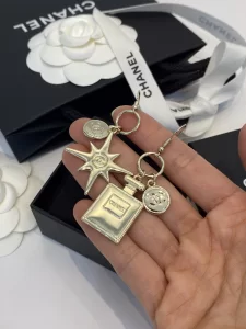 Chanel Gold Bottle Star Earrings 
