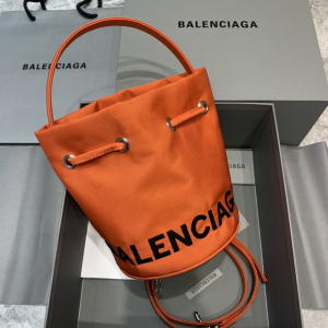 Balenciaga Wheel XS Canvas Drawstring Bucket Bag Orange Balenciaga Wheel XS Canvas Drawstring Bucket Bag Orange