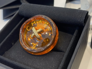 Chanel Orange Button Brooch