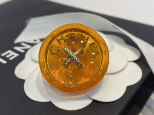 Chanel Orange Button Brooch