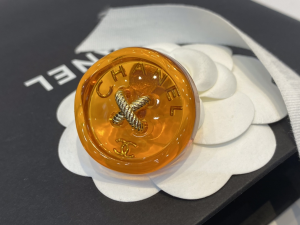 Chanel Orange Button Brooch
