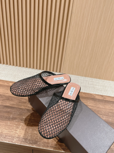 Alaia Black Fishnet Flat Mules