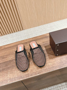 Alaia Black Fishnet Flat Mules