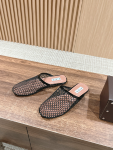 Alaia Black Fishnet Flat Mules