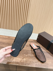 Alaia Black Fishnet Flat Mules