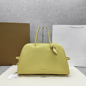 Jacquemus The Turismo Soft Grained Leather Bowling Crossbody Bag Yellow Jacquemus The Turismo Soft Grained Leather Bowling Crossbody Bag Yellow